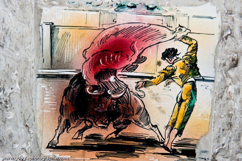 Traditional tile artwork of matador and bull at Plaza de Toros Monumental, Barcelona — cultural travel photography focus